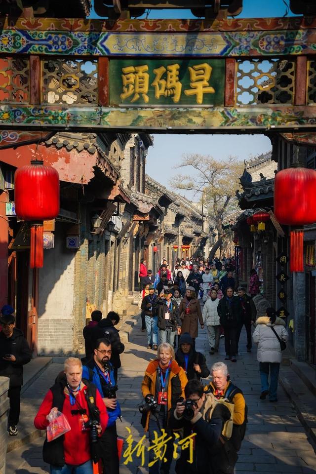 感受古街古韵！中外摄影家聚焦周村古商城